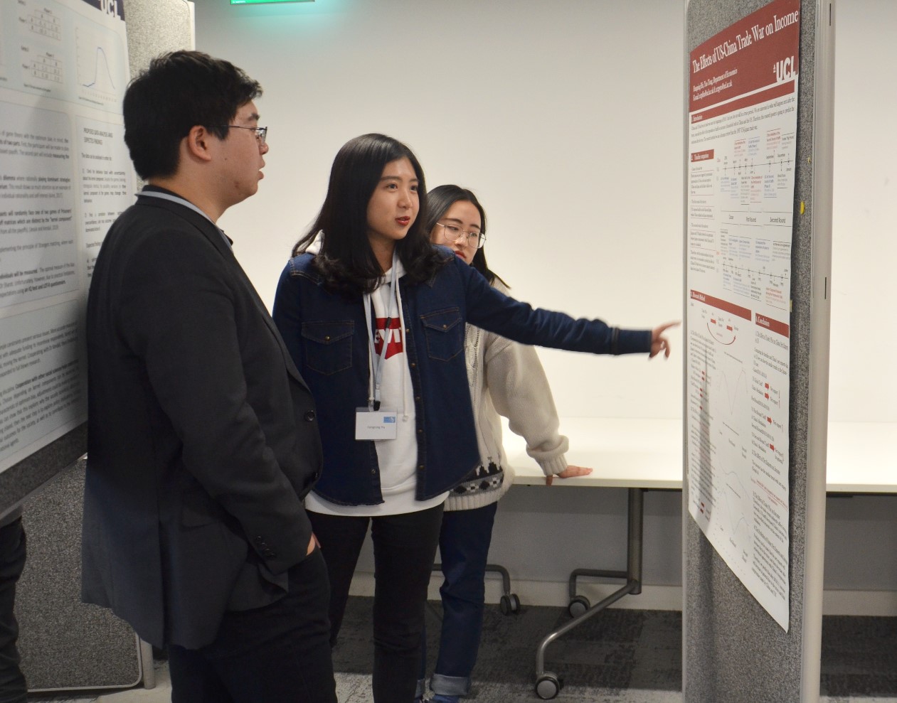 Fangning Hu and Yao Tong explaining their posters