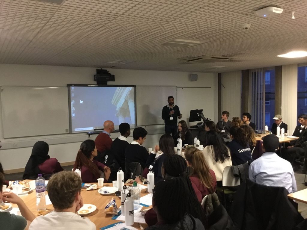 Imran Rasul presenting to students